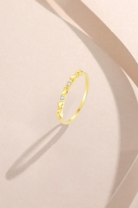Detailed macro view of S925 sterling silver gold ring featuring 3D hearts and zircons