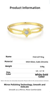 Macro shot of S925 silver star ring with sparkling cubic zirconia inlay and gold finish