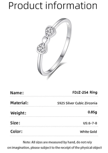 Macro detail of S925 silver bow ring with cubic zirconia including product specifications