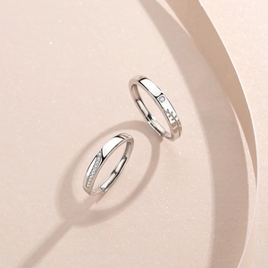 Intertwined S925 sterling silver couple rings with adjustable bands and cubic zirconia