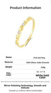 Detail view of S925 sterling silver ring with heart relief and cubic zirconia stones