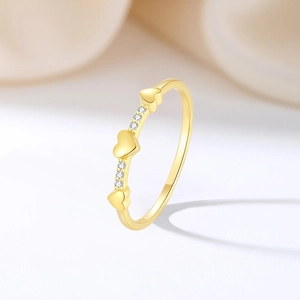 Elegant S925 sterling silver ring featuring three golden hearts and sparkling zircon accents