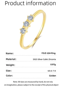 Macro detail of S925 silver golden ring with three cubic zirconia stones and weight specs