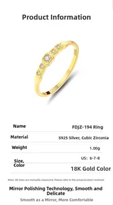Macro detail of S925 silver square ring with 18K gold finish and cubic zirconia gems