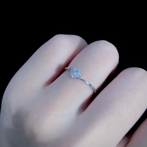 Sparkling S925 silver heart ring with pavé diamonds shown on a model's finger