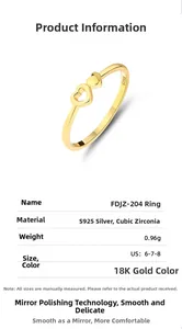 Macro view of S925 silver double heart ring with gold finish and cubic zirconia inlay