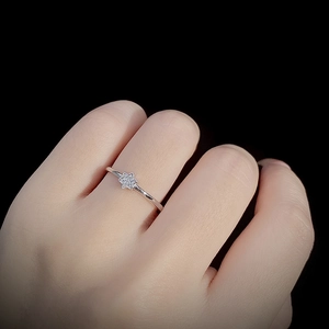 Elegant S925 sterling silver star ring with micro-pave zircons worn on model's hand