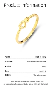 Macro detail of S925 silver heart ring with 18K gold plating and cubic zirconia inlay
