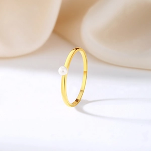 Minimalist S925 sterling silver ring featuring a polished gold band and a glossy white pearl
