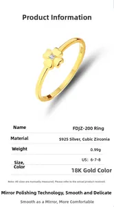 Macro shot of S925 silver four-leaf clover ring with 18K gold finish and zircon stone