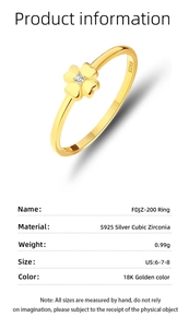 Detail view of gold clover ring with S925 silver stamp and sparkling zircon stone