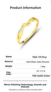 Macro shot of 18K gold S925 silver knot ring with cubic zirconia and engraved hallmark