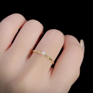 Minimalist S925 sterling silver gold plated ring with a single white pearl on hand