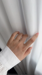 Detailed close-up of a twisted rope gold ring band made of S925 sterling silver