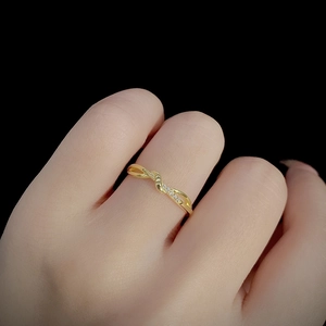 Elegant gold S925 sterling silver twisted ring with shimmering zircon stones for women