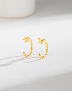 Close-up of S925 hallmark on gold plated sterling silver star C-shaped earrings