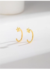 Detailed macro view showing the S925 hallmark on gold-plated star C-shape earrings