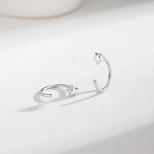 Elegant S925 sterling silver C-shaped hoop earrings with 3D star charms on white background
