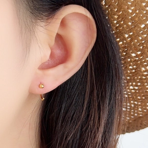Minimalist S925 sterling silver golden ball hook earrings shown on a model
