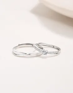 Macro detail of S925 sterling silver Mobius rings with sparkling cubic zirconia settings