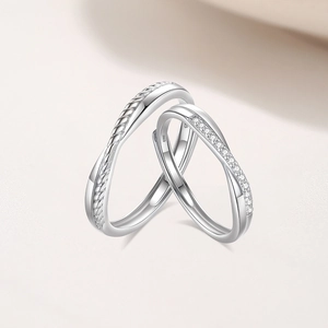 S925 silver Mobius couple rings featuring twisted texture and sparkling cubic zirconia