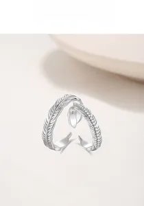 Macro shot of S925 sterling silver feather rings featuring cubic zirconia pavé detailing