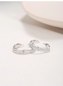 Detailed close-up of S925 sterling silver feather rings with micro-pave zircon inlay