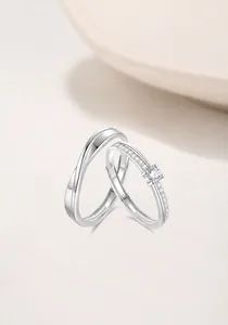 Detail of S925 silver Mobius couple rings set with cubic zirconia and adjustable band