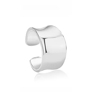 Detailed view of silver S925 sterling silver wide wave ear cuff with polished surface