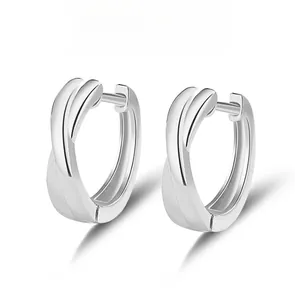 Detailed view of S925 silver hoop earrings with minimalist crossed spiral twist design