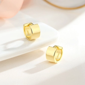Polished S925 sterling silver wide hoop earrings in gold finish with hallmark