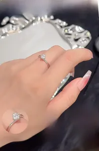 Detail showing S925 silver four-prong solitaire ring with manual mirror polishing