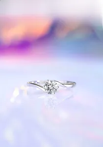 Macro shot of 0.5 carat moissanite ring with six-prong crown setting and bypass band