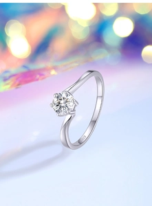 Close-up of S925 sterling silver stamp on a wave-shaped moissanite solitaire ring