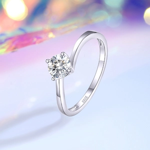 Elegant S925 sterling silver four-prong round solitaire moissanite ring with a sleek band