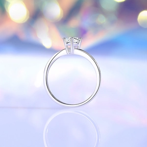 S925 sterling silver four-prong moissanite ring with a brilliant round cut and reflection