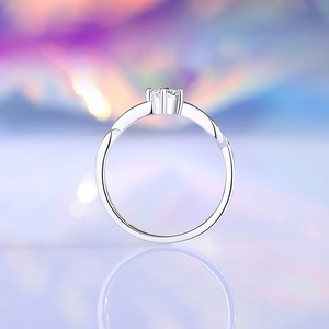Elegant 925 silver moissanite ring featuring a wavy band and classic six-prong setting
