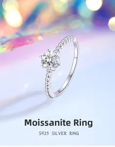 Macro shot of S925 sterling silver ring showing hallmark and moissanite stone detail