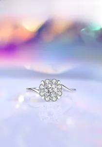 Macro shot of S925 silver moissanite ring with round cut center stone and twisted band