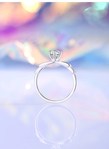 Detailed close-up of 0.5ct Moissanite ring with classic six-prong setting and wing accents