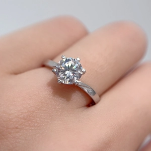Elegant six-prong 1ct moissanite S925 silver ring worn on hand with brilliant sparkle