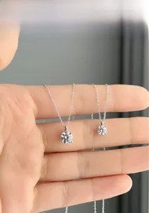 Comparison of two round moissanite pendant sizes on classic S925 silver cable chains
