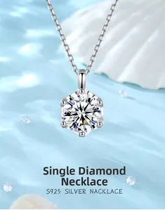 Macro shot of 5mm moissanite necklace with 6-prong silver crown setting on blue water effect