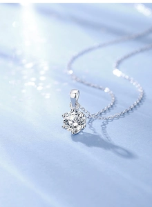 Macro shot of a classic six-prong set solitaire round brilliant cut moissanite pendant