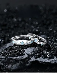 Detailed shot of S925 sterling silver couple rings with blue enamel meteor pattern
