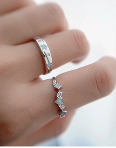 Macro shot of S925 sterling silver star rings with blue enamel and zircon inlay