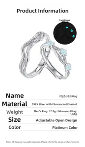 Macro view of adjustable S925 silver couple rings featuring luminous blue flower and bark texture