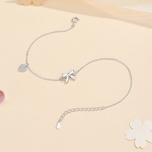 S925 sterling silver anklet with sparkling heart charm and polished bow decoration