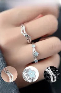 Detail of S925 silver rings with fluorescent enamel flowers and mirror polished finish
