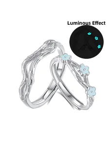 Detail of S925 sterling silver couple rings showing blue floral design and luminous effect